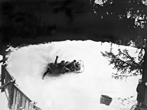 <b class=qtipBold><figcaption>Bobsled Run In Switzerland</figcaption></b><br>Montana, Valias, Switzerland: c. 1938. A bobsled takes at sharp curve on the giant bobsled run at Montana in the Valais.<br><em>© Underwood Archives/UIG</em> Bobsled Run In Switzerland