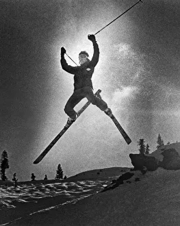 <b class=qtipBold><figcaption>A Bold Leap By A Skier</figcaption></b><br>United States: c. 1970 A skier profiled against the sky as he leaps through the air.<br><em>© Underwood Archives/UIG</em> A Bold Leap By A Skier