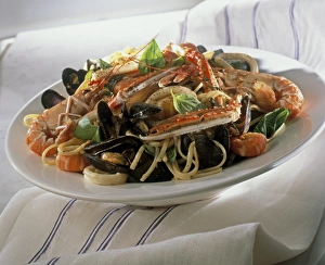 Bowl of spaghetti with mixed shellfish including prawns and mussels Bowl of spaghetti with mixed shellfish including prawns and mussels