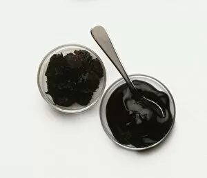 Bowls of black tamarind pulp and jelly