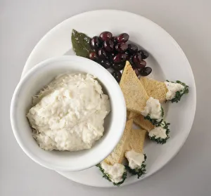 Brandade de Morue, a puree made from cod, cream and garlic, served with bread and fruit garnish, a typical dish from Provence, France, view from above Brandade de Morue, a puree made from cod, cream and garlic, served with bread and fruit garnish, a typical dish from Provence, France, view from above