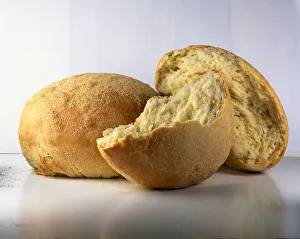 Whole and broken loaves of Pane, Semolina bread Whole and broken loaves of Pane, Semolina bread