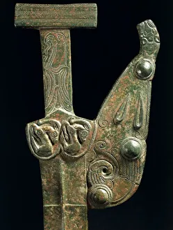 Bronze emblem-sword, detail of hilt, from Medgidia Bronze emblem-sword, detail of hilt, from Medgidia