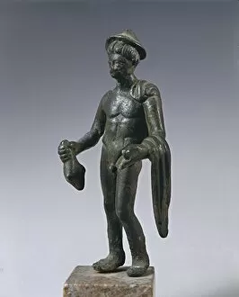 Roman God Gallery: Bronze statuette of Mercury, holding bag and his cloak, From Volubilis (Morocco)