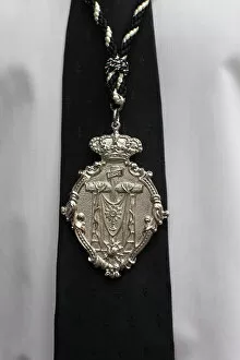 Easter Week Gallery: Catholic fraternity members medal