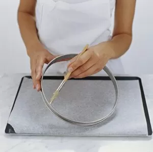 Basting Brush Gallery: Chef using basting brush to butte tart ring on baking tray