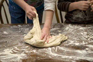 <b class=qtipBold><figcaption>Children kneading dough</figcaption></b><br><em>© Dorling Kindersley/UIG</em> Children kneading dough