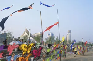 China, Hubei, Wuhan, Yangzi riverfront, colourful kites for sale blowing in the wind China, Hubei, Wuhan, Yangzi riverfront, colourful kites for sale blowing in the wind