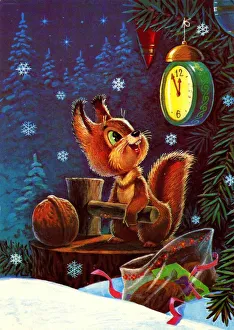 Under the Christmas tree squirrel looks at his watch and preparing to break a walnut with a hammer Under the Christmas tree squirrel looks at his watch and preparing to break a walnut with a hammer