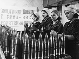 Civilian women making artillery shells at a munitions factory in moscow during world war Civilian women making artillery shells at a munitions factory in moscow during world war