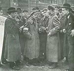 Civilians talking to soldier on street