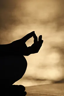 Close up hand of young of woman practice meditation in lotus position. Yoga at sunset Close up hand of young of woman practice meditation in lotus position. Yoga at sunset