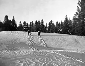 <b class=qtipBold><figcaption>Cross Country Skiing In Quebec</figcaption></b><br>Morin Heights, Quebec, Canada: c. 1959. Two cross country skiers herring-bone up a slope in the Laurentian mountains north of Montreal.<br><em>© Underwood Archives/UIG</em> Cross Country Skiing In Quebec