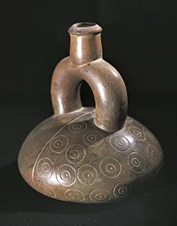 Dark ceramic stirrup spout vessel engraved with geometric patterns, Peru, Chavin culture Dark ceramic stirrup spout vessel engraved with geometric patterns, Peru, Chavin culture