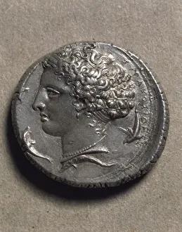Decadrachm of Syracuse depicting a female head (probably the head of Artemis or Arethusa) surrounded by dolphins Decadrachm of Syracuse depicting a female head (probably the head of Artemis or Arethusa) surrounded by dolphins