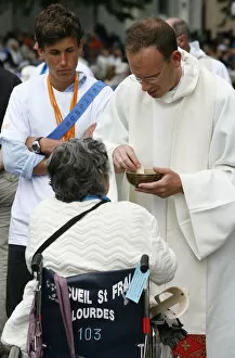 Images Dated 19th April 2000: Disabled woman receiving holy communion