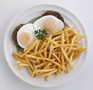 Cholesterol Collection: Dish of hamburgers, chips and fried eggs