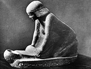 Egyptian woman grinding corn using a saddle quern. Egyptian tomb figure c 2, 500 BC Egyptian woman grinding corn using a saddle quern. Egyptian tomb figure c 2, 500 BC