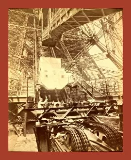 Images Dated 1st January 1889: Eiffel Tower Machinery With A Man Beside The Wheel That Raises Elevator