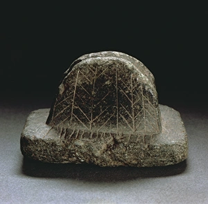 Engraved soapstone tool used to smooth objects, from nuragic village of Isportana Engraved soapstone tool used to smooth objects, from nuragic village of Isportana
