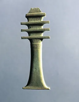 Faience amulet representing Djed pillar, symbol of stability and endurance, linked to god Osiris Faience amulet representing Djed pillar, symbol of stability and endurance, linked to god Osiris