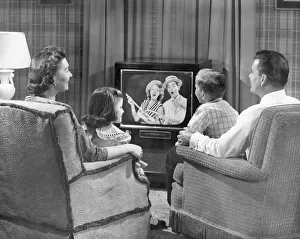 Family gathered around the television, 1950-60s Our beautiful pictures are  available as Framed Prints, Photos, Wall Art and Photo Gifts