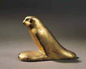 Gilded wood mummified falcon, late period Gilded wood mummified falcon, late period