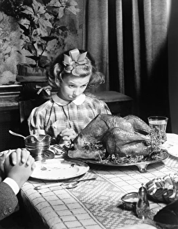 <b class=qtipBold><figcaption>Girl looking at turkey dinner</figcaption></b> Girl looking at turkey dinner