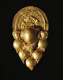 Gold cluster earring from Spina, Ferrara Province Gold cluster earring from Spina, Ferrara Province