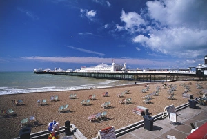 Great Britain, England, Brighton, view across sandy beach dotted with deckchairs towards Great Britain, England, Brighton, view across sandy beach dotted with deckchairs towards