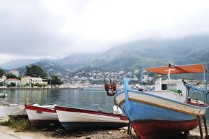 Vathy Gallery: Greek Islands, Ithaki, Vathy, fishing boats moored at waters edge with fog above mountains in distance