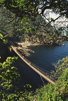 A hanging bridge across Storms River Mouth in the Tsitsikamma National Park A hanging bridge across Storms River Mouth in the Tsitsikamma National Park