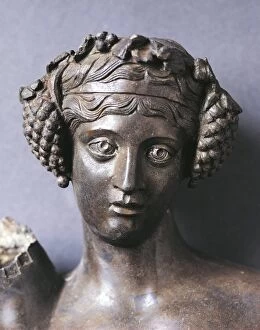 Roman God Gallery: Detail of the head of Bacchus (Dionysus, god of wine), bronze