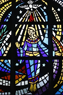 Holy ghost & Virgin Mary depicted on stained glass Holy ghost & Virgin Mary depicted on stained glass
