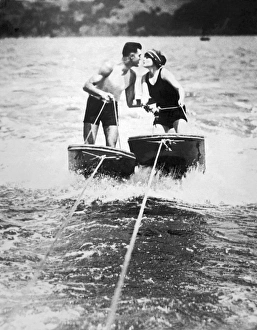 <b class=qtipBold><figcaption>Honeymooners On SF Bay</figcaption></b><br>San Francisco, California: September 11, 1924. A couple on their honeymoon braves the chilly waters of San Francisco Bay as they 'aquaplane' to a kiss.<br><em>© Underwood Archives/UIG</em> Honeymooners On SF Bay