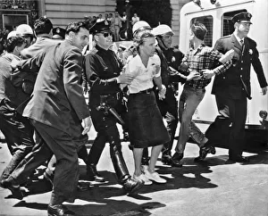 <b class=qtipBold><figcaption>HUAC Protesters Arrested In SF</figcaption></b><br>San Francisco, California: March 1, 1961. Three wet and defiant protesters of the House Un-American Activities Committee hearing at San Francisco City Hall are taken to the paddy wagon Sixty four total college age persons were arrested after being hosed by the police. The HUAC claimed that Communists masterminded the protest.<br><em>© Underwood Archives/UIG</em> HUAC Protesters Arrested In SF