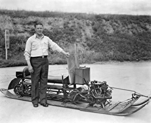 <b class=qtipBold><figcaption>Inventor Of First Snowmobile</figcaption></b><br>Sayner, Wisconsin: 1932. Carl J. Eliason, inventor and manufacturer of the first successful snowmobile, proudly stands beside one of his early 'snow machines', which he patented in 1927.<br><em>© Underwood Archives/UIG</em> Inventor Of First Snowmobile