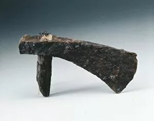 Iron hatchet with part of handle, from Pompei