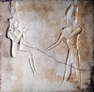Isis and Osiris, Ancient Egyptian gods, parents of the falcon god Horus. Bas-relief Isis and Osiris, Ancient Egyptian gods, parents of the falcon god Horus. Bas-relief