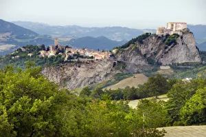 Italy, Emilia-Romagna, Rimini, San Leo, countryside and landscape with town built Italy, Emilia-Romagna, Rimini, San Leo, countryside and landscape with town built