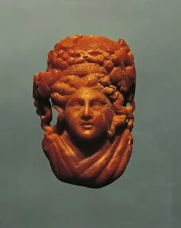 Roman God Gallery: Italy, Friuli-Venezia Giulia, Box with Dyonisos head Amber, from the necropolis of Aquileia