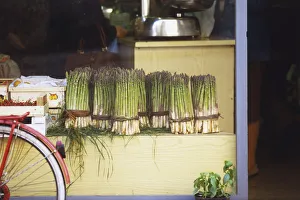 Italy, Northern Tuscany, Pescia, green asparagus tips tied in bunches with leaves Italy, Northern Tuscany, Pescia, green asparagus tips tied in bunches with leaves