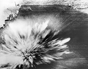 A Japanese bomb explodes on the flight deck of the USS Enterprise, killing the photographer A Japanese bomb explodes on the flight deck of the USS Enterprise, killing the photographer