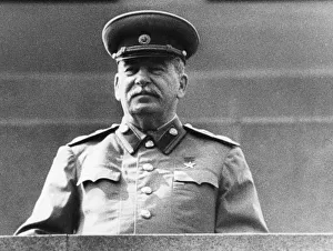 Joseph stalin standing on lenins tomb in red square, reviewing the may day parade in 1952 Joseph stalin standing on lenins tomb in red square, reviewing the may day parade in 1952
