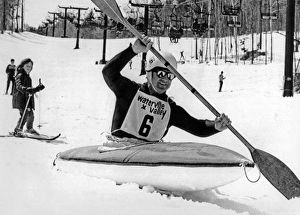 <b class=qtipBold><figcaption>Kayaking Down The Mountain</figcaption></b><br>Waterville Valley, New Hampshire: April, 1972 Skiers are a bit surprised to be passed by a kayaker on their way down the mountain, but he's just in training for the White Water championship on the Mad River this weekend.<br><em>© Underwood Archives/UIG</em> Kayaking Down The Mountain