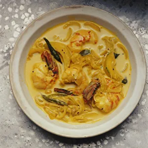 Konju pulungari (pumpkin and coconut milk) curry served in bowl Konju pulungari (pumpkin and coconut milk) curry served in bowl