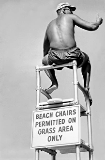 <b class=qtipBold><figcaption>Lifeguard At The Beach</figcaption></b><br>United States: c. 1967. A lifeguard at a pool gives the thumbs up sign.<br><em>© Underwood Archives/UIG</em> Lifeguard At The Beach