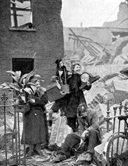Londoners made homeless by a German bombing raid during the Blitz of 1940 holding Londoners made homeless by a German bombing raid during the Blitz of 1940 holding