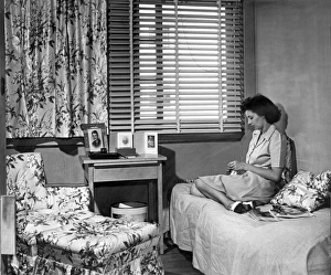 <b class=qtipBold><figcaption>Lonely World War II War Worker</figcaption></b><br>Arlington Farms, Virginia: March, 1944. A woman who works for the War Department in her single room in the government's housing project for war workers. She has a two year old son and her husband is in the Navy.<br><em>© Underwood Archives/UIG</em> Lonely World War II War Worker