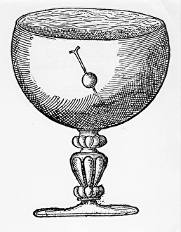 A magnetized needle pushed through a ball of cork, and floating submerged in a goblet of A magnetized needle pushed through a ball of cork, and floating submerged in a goblet of